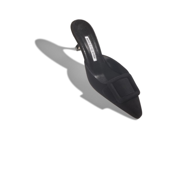 Manolo Blahnik Shoes - Black suede mules featuring suede buckle and kitten heel.